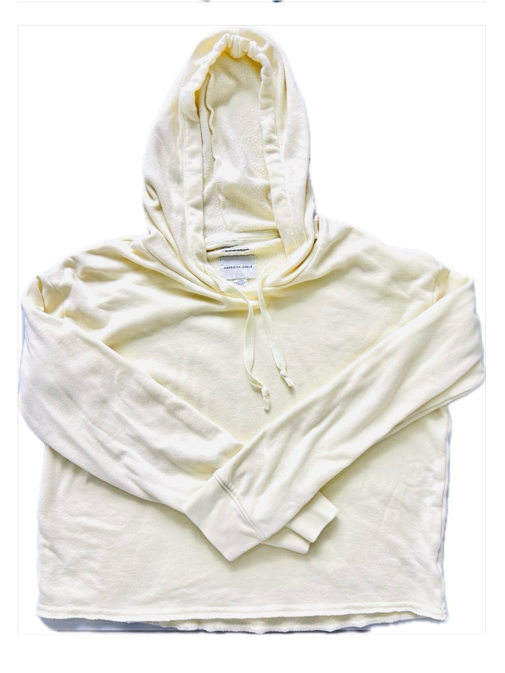 light yellow SOFT American Eagle cropped hoodie drawstring and raw hem Size S